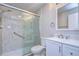 Updated bathroom with a walk-in shower and white vanity at 11505 Blackbark Dr, Riverview, FL 33579