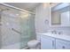 Updated bathroom with a walk-in shower and white vanity at 11505 Blackbark Dr, Riverview, FL 33579