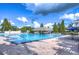 Community pool with lounge chairs at 11505 Blackbark Dr, Riverview, FL 33579