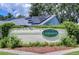 Laurelwood community entrance sign with solar panels at 11505 Blackbark Dr, Riverview, FL 33579