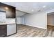 Open dining area with wood-look flooring and access to the kitchen at 11505 Blackbark Dr, Riverview, FL 33579