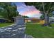 House exterior featuring a stone facade, green lawn, and driveway at 11505 Blackbark Dr, Riverview, FL 33579