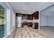 Modern kitchen with stainless steel appliances and dark cabinets at 11505 Blackbark Dr, Riverview, FL 33579
