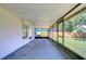 Screened porch with view of backyard at 11505 Blackbark Dr, Riverview, FL 33579