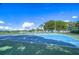 Two lighted tennis courts at 11505 Blackbark Dr, Riverview, FL 33579