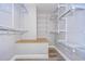 Spacious walk-in closet with ample shelving and hanging rods at 11505 Blackbark Dr, Riverview, FL 33579