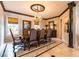 Formal dining room with chandelier and hardwood floors at 11710 N Armenia Ave, Tampa, FL 33612