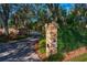 Brick pillars and walkway lead to a private gated entrance at 11710 N Armenia Ave, Tampa, FL 33612