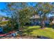 Backyard oasis with lush landscaping and lake access at 11710 N Armenia Ave, Tampa, FL 33612