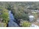 Aerial view of waterfront property showing house and surrounding area at 1214 E Park Cir, Tampa, FL 33604