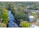 Aerial view of a modern home on the waterfront with a pool at 1214 E Park Cir, Tampa, FL 33604