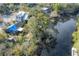 Aerial view of house near river with landscaping and neighboring properties at 1214 E Park Cir, Tampa, FL 33604