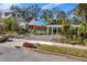 Charming bungalow with a pergola and flowering vines at 1214 E Park Cir, Tampa, FL 33604