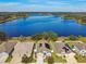 Aerial view of lakefront homes with solar panels at 12645 Flatwood Creek Dr, Gibsonton, FL 33534