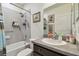 Bathroom with tub, shower, and single vanity at 12645 Flatwood Creek Dr, Gibsonton, FL 33534