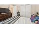 Bedroom with full-size bed and double door closet at 12645 Flatwood Creek Dr, Gibsonton, FL 33534