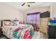 Bedroom with a queen-size bed and plenty of space at 12645 Flatwood Creek Dr, Gibsonton, FL 33534