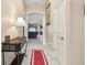 Bright entry hall with view to living room at 12645 Flatwood Creek Dr, Gibsonton, FL 33534