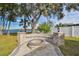 Cozy fire pit area with stone seating, perfect for outdoor gatherings at 12645 Flatwood Creek Dr, Gibsonton, FL 33534