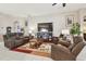 Living room with comfortable seating and a large TV at 12645 Flatwood Creek Dr, Gibsonton, FL 33534