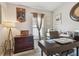 Home office with a desk, chair and large window at 12645 Flatwood Creek Dr, Gibsonton, FL 33534