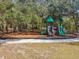 Community playground with playset and swings at 12645 Flatwood Creek Dr, Gibsonton, FL 33534