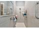 Walk-in shower with tiled walls and grab bar at 12645 Flatwood Creek Dr, Gibsonton, FL 33534