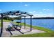 Relaxing lakeside picnic area with grills and tables at 12703 Lake Hills Dr, Riverview, FL 33569