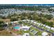 Aerial view of community with pool, shuffleboard, and homes at 14052 89Th Ave, Seminole, FL 33776