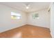 Spacious bedroom with light wood flooring and ceiling fan at 14052 89Th Ave, Seminole, FL 33776