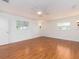 Bright bedroom with hardwood floors and ceiling fan at 14052 89Th Ave, Seminole, FL 33776