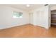 Bright bedroom with wood flooring and double closets at 14052 89Th Ave, Seminole, FL 33776