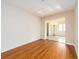 Simple dining room with wood-look floors and a view to the kitchen at 14052 89Th Ave, Seminole, FL 33776