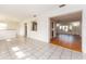 Open dining area with tile floors and views into living room at 14052 89Th Ave, Seminole, FL 33776