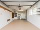 Clean and spacious garage with ample storage shelving and overhead door at 14052 89Th Ave, Seminole, FL 33776