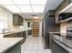 Updated kitchen boasts stainless steel appliances and granite countertops at 14052 89Th Ave, Seminole, FL 33776