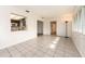 Bright living room with tile flooring and kitchen pass-through at 14052 89Th Ave, Seminole, FL 33776