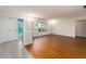 Bright living room with wood-look floors and large windows at 14052 89Th Ave, Seminole, FL 33776