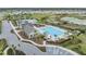 Aerial view of community pool, clubhouse, and surrounding neighborhood at 14136 Swiss Bridge Dr, Riverview, FL 33579