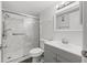 Bathroom with marble shower and gray vanity at 1524 Lakeview Rd # 305, Clearwater, FL 33756
