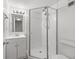 Updated bathroom with walk-in shower and white vanity at 1524 Lakeview Rd # 305, Clearwater, FL 33756