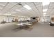 Spacious community room with tables, chairs, and a fireplace at 1524 Lakeview Rd # 305, Clearwater, FL 33756