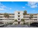 Attractive condo building with ample parking and lush landscaping at 1524 Lakeview Rd # 305, Clearwater, FL 33756