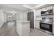 Modern kitchen with stainless steel appliances and island at 1524 Lakeview Rd # 305, Clearwater, FL 33756