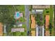 An aerial view showcasing the community layout and pool at 1701 Pinehurst Rd # 33A, Dunedin, FL 34698