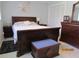 Primary bedroom with a sleigh bed and a large dresser at 1701 Pinehurst Rd # 33A, Dunedin, FL 34698