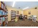 Community room with bookshelves, computer, and work area at 1701 Pinehurst Rd # 33A, Dunedin, FL 34698