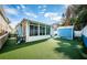 Spacious backyard with artificial turf and blue shed at 17744 1St E St, Redington Shores, FL 33708