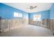 A room currently under renovation, featuring light blue walls and new tile flooring at 17744 1St E St, Redington Shores, FL 33708