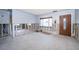 Under renovation living room with exposed walls and flooring at 17744 1St E St, Redington Shores, FL 33708